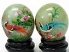 Pair of Chinese Painted Stone Eggs on Wood Stands.