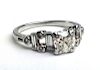 Ladies platinum engagement ring ½ct with round cut diamond 5mm x 3.2mm each side having 2 small bagu