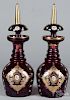Pair of enameled ruby glass decanters, late 19th c., 18 1/4'' h.