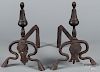 Pair of Continental iron andirons, 18th c., with tooled decoration on the feet, 13'' h.