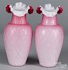 Pair of quilted satin glass vases, 10 1/2'' h., together with two etched pink glass vases, 10 1/4'' h.