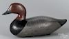 Carved and painted redhead duck decoy, mid 20th c., attributed to Madison Mitchell, 13 1/2'' l.