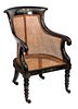 A Late Regency Black and Gilt Japanned Mahogany Library Armchair Height 35 1/2 inches.