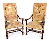A Pair of Franco-Flemish Walnut Armchairs Height 40 inches.