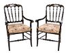 A Pair of Victorian Black and Gilt Painted Armchairs Height 36 inches.