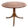 A Louis XVI Style Tulipwood and Parquetry Circular Occasional Table Height 28 1/4 x diameter 19 1/2 inches.