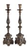 A Pair of Baroque Style Patinated Giltwood Candlesticks Height 30 1/2 inches.