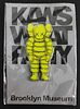 KAWS (American, b.1974) "What Party?" yellow small pin, brand new, 2 3/4 x 1 1/4 in.