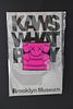 KAWS (American, b.1974) "What Party?" bright pink and blue pin, never opened 1 1/2 x 1 1/2 in.