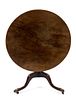 A George III Style Tilt-Top Table Height of first 29 x diameter 39 inches.