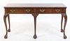 A Baker Chippendale Style Mahogany Console Table Height 28 1/2 x width 54 x depth 15 3/4 inches.
