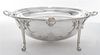 * A Silver-plate Bacon Warmer, , of ovoid form with a rotating lid and raised on four monoped feet.