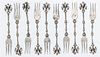 * Ten German Silver Cocktail Forks Length 3 5/8 inches.