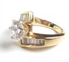 14K yellow gold lady's ring with round cut center imitation diamond, 8.3 g total wt