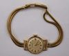 JEWELRY. Lady's Movado 18kt Yellow Gold Watch.