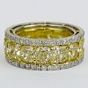 Fancy Yellow Diamond and Platinum Eternity Band Set with Fifteen (15) Cushion Cut Fancy Yellow Diamonds Approx. 10.85 Carat TW and accented with Appro
