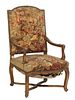French Louis XV Style Gilt Fauteuil a la Reine, 19th c., the arched upholstered canted back to scrolled arms over a bowed upholstered seat, on cabriol