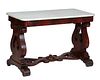 American Classical Carved Mahogany Marble Top Side Table, 19th c., the rounded edge rectangular figured white marble over a wide skirt, on pierced lyr