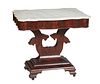 American Classical Carved Mahogany Marble Top Side Table, 19th c., the serpentine ogee edge figured white marble over a wide serpentine skirt, on a ly