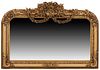 Louis XIV Style Gilt Composition Horizontal Overmantel Mirror, 21st c., with an ornate relief scroll and floral crest above two arched floral garlands