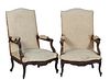 Pair of French Louis XV Style Carved Walnut Fauteuils a la Reine, 19th c., the arched canted upholstered back to upholstered arms and a bowed upholste
