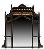 English Aesthetic Carved Ebonized Gilt Incised Overmantel Mirror, c. 1880, with an incised arched crest flanked by finialed pilasters, above a concave
