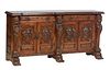 French Renaissance Style Carved Beech Sideboard, 20th c., the stepped breakfront top over two long frieze drawers above two setback high relief grotes