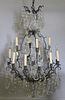 Patinated Metal 12 Light Chandelier with Crystals.