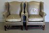 Pair of Leather Upholstered Wing Arm Chairs.