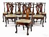 Set of eight George III mahogany dining chairs, ca. 1760, each with a carved crest
