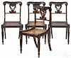 Set of four English Regency rosewood dining chairs, ca. 1830, with cane seats.