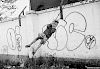 Martha Cooper, Girl on rope swing with graffiti wall