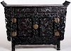 A LARGE HEAVILY CARVED CHINESE ZITAN ALTAR COFFER