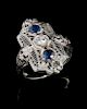 AN ART DECO STYLE 18K RING WITH DIAMONDS AND SAPPHIRES