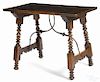 Spanish baroque style walnut table with a wrought iron trestle, 29'' h., 37'' w., 23 1/2'' d.