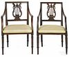 Pair of French Directoire fruitwood armchairs, early 19th c.
