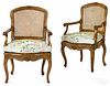 Pair of French Louis XV carved fruitwood fauteuils, 19th c.