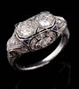 A 1930S PLATINUM DIAMOND AND SAPPHIRE SCROLL RING