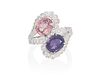 A pink sapphire, purple sapphire and diamond ring