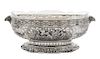 * A German Silver Center Bowl, , having pierced floral and C-scroll decoration interspersed with two cartouches depicting putti