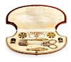 * A Victorian Gilt Metal Sewing Kit Width of case 7 3/4 inches.