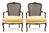 A Pair of Louis XV Style Walnut Fauteuils Height 37 inches.