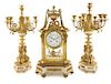 A Louis XVI Style Gilt Bronze and Marble Clock Garniture Height of candelabra 22 3/4 inches.
