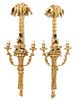 A Pair of Continental Parcel Ebonized Giltwood Two-Light Sconces Height 33 inches.