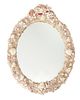 An oval shell wall mirror