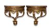 A pair of Continental carved giltwood wall shelves