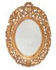 An carved giltwood wall mirror