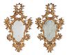 A pair of Northern Italian carved giltwood wall mirrors