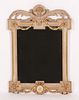 A Neoclassical style parcel gilt and painted mirror