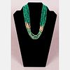 A 14kt. Yellow Gold and Malachite Beaded Necklace.